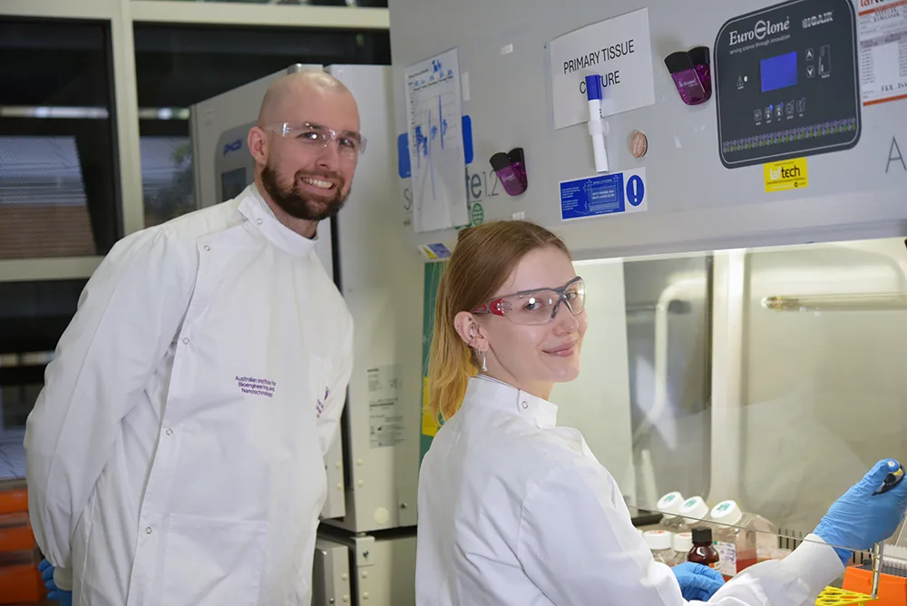 Dr Liam O'Brien and Hannah Tompkins in the cancer vaccine laboratory at AIBN